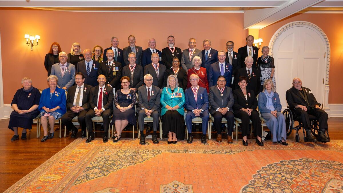 A group photo featuring Governor General Simon and honours recipients. 