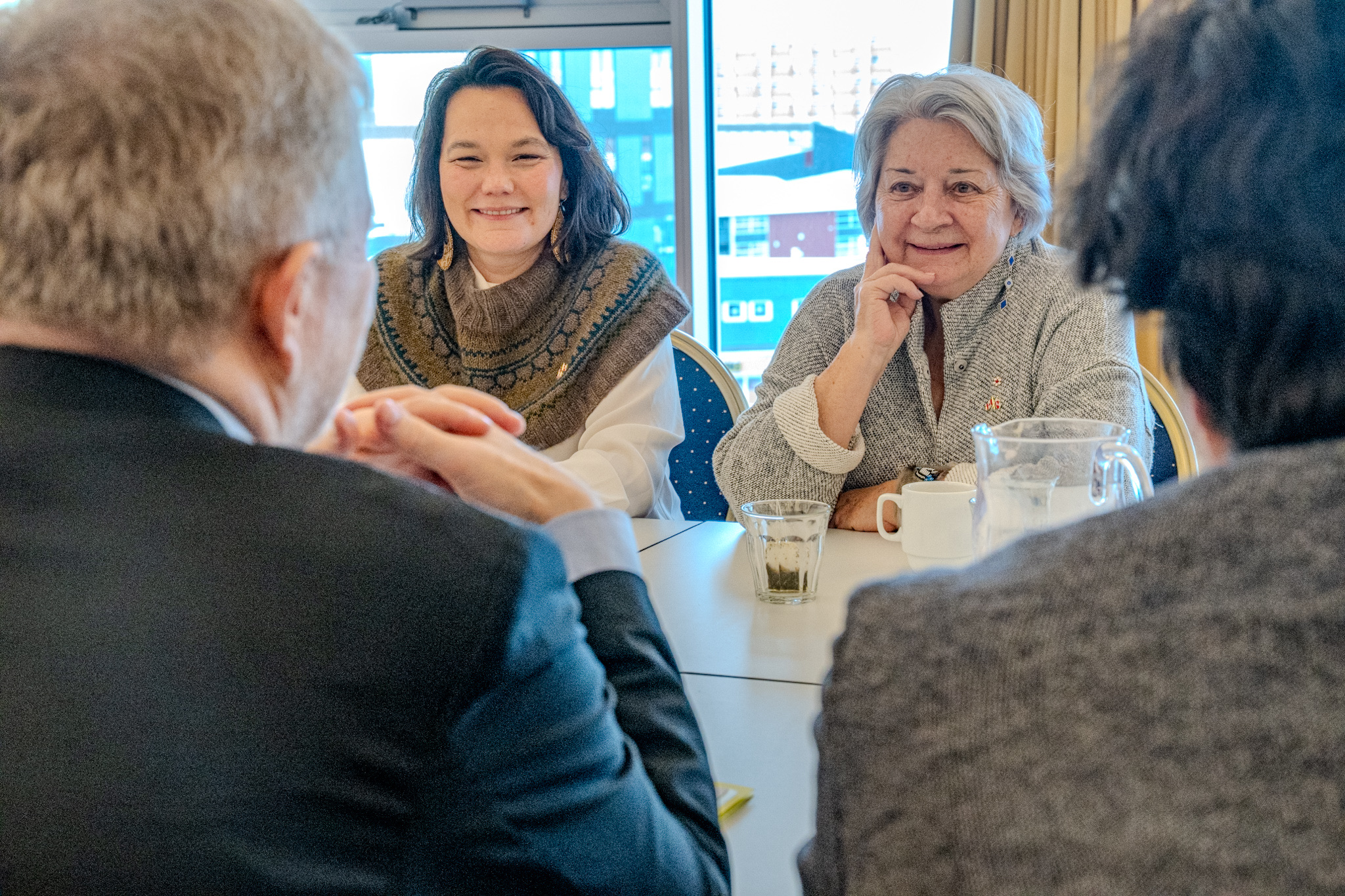 Governor General Mary Simon seated at a table with several leaders.