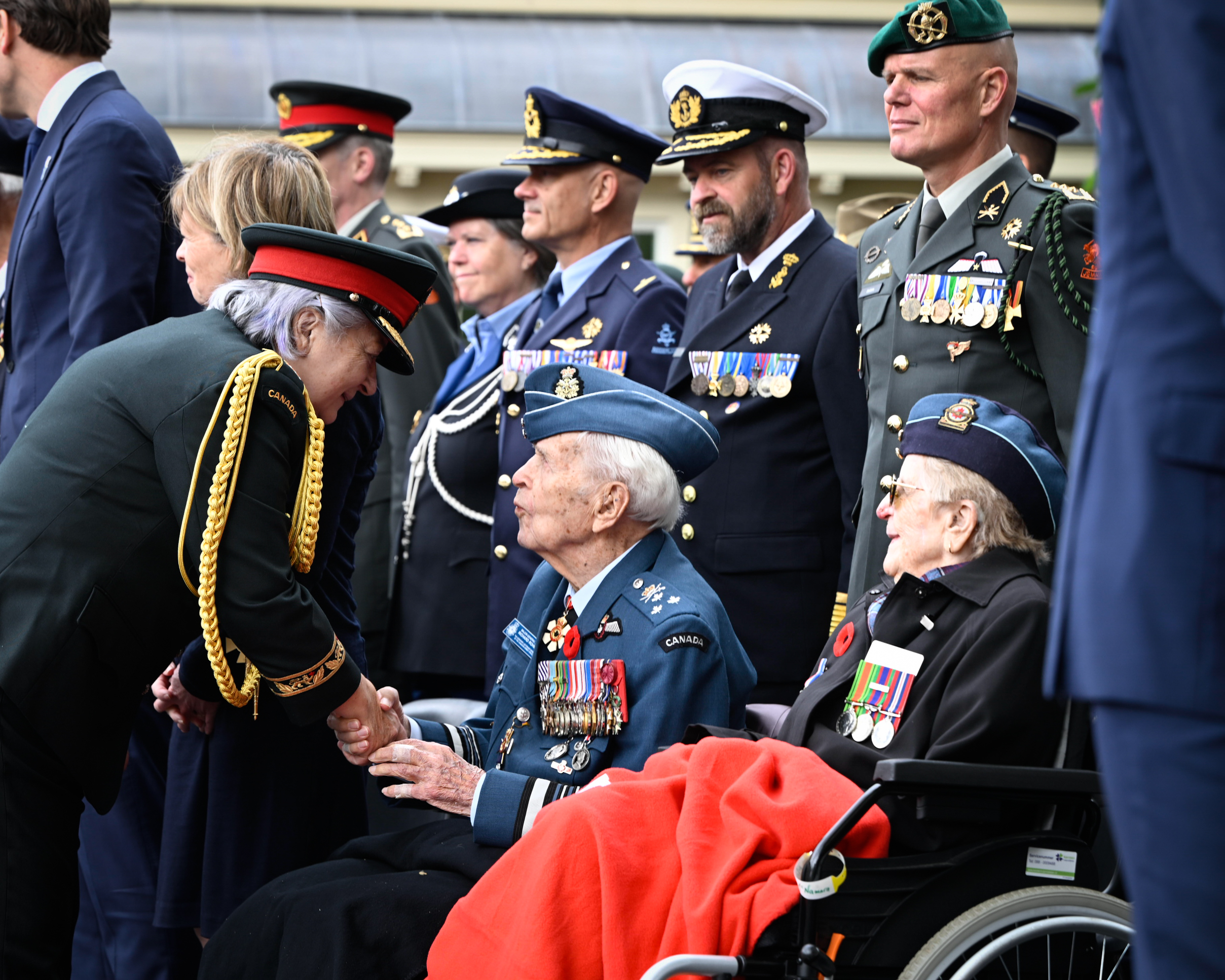 Governor General Mary Simon meeting a veteran at the Freedom Parade.