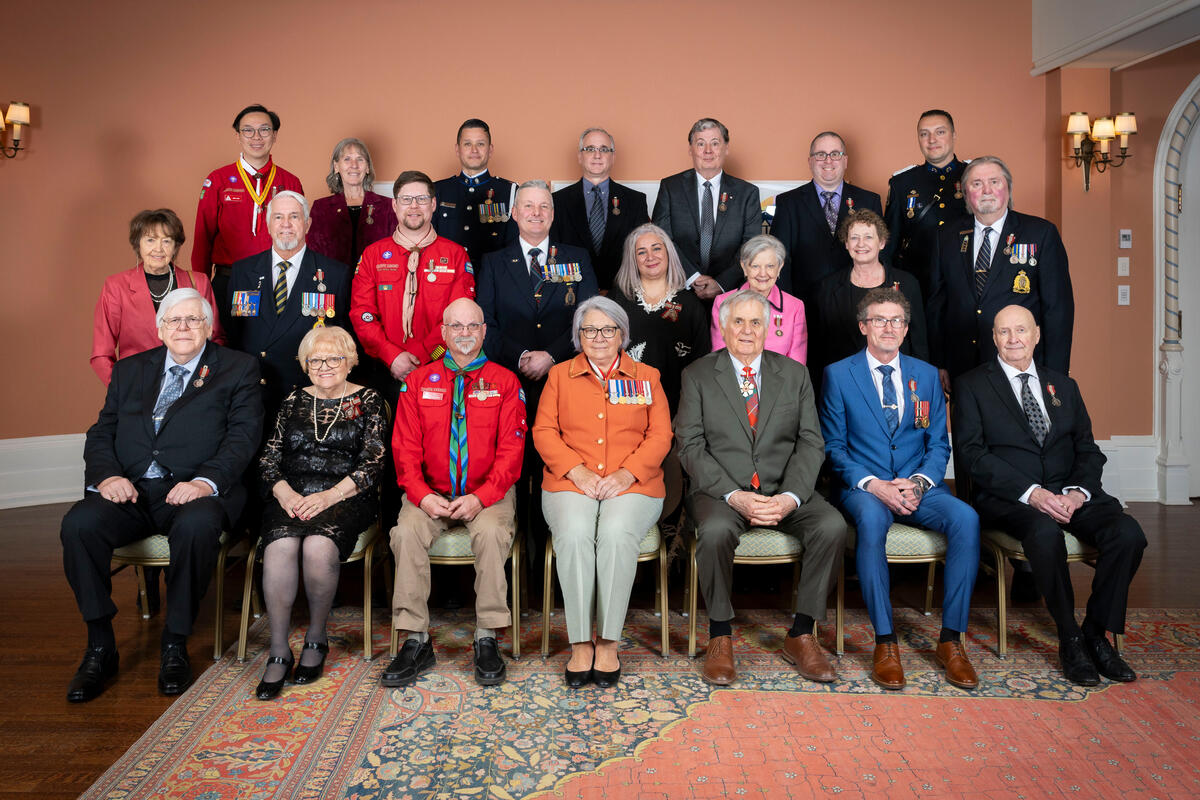 Governor General Mary Simon and Mr. Whit Fraser with Sovereign Medal for Volunteers recipients.