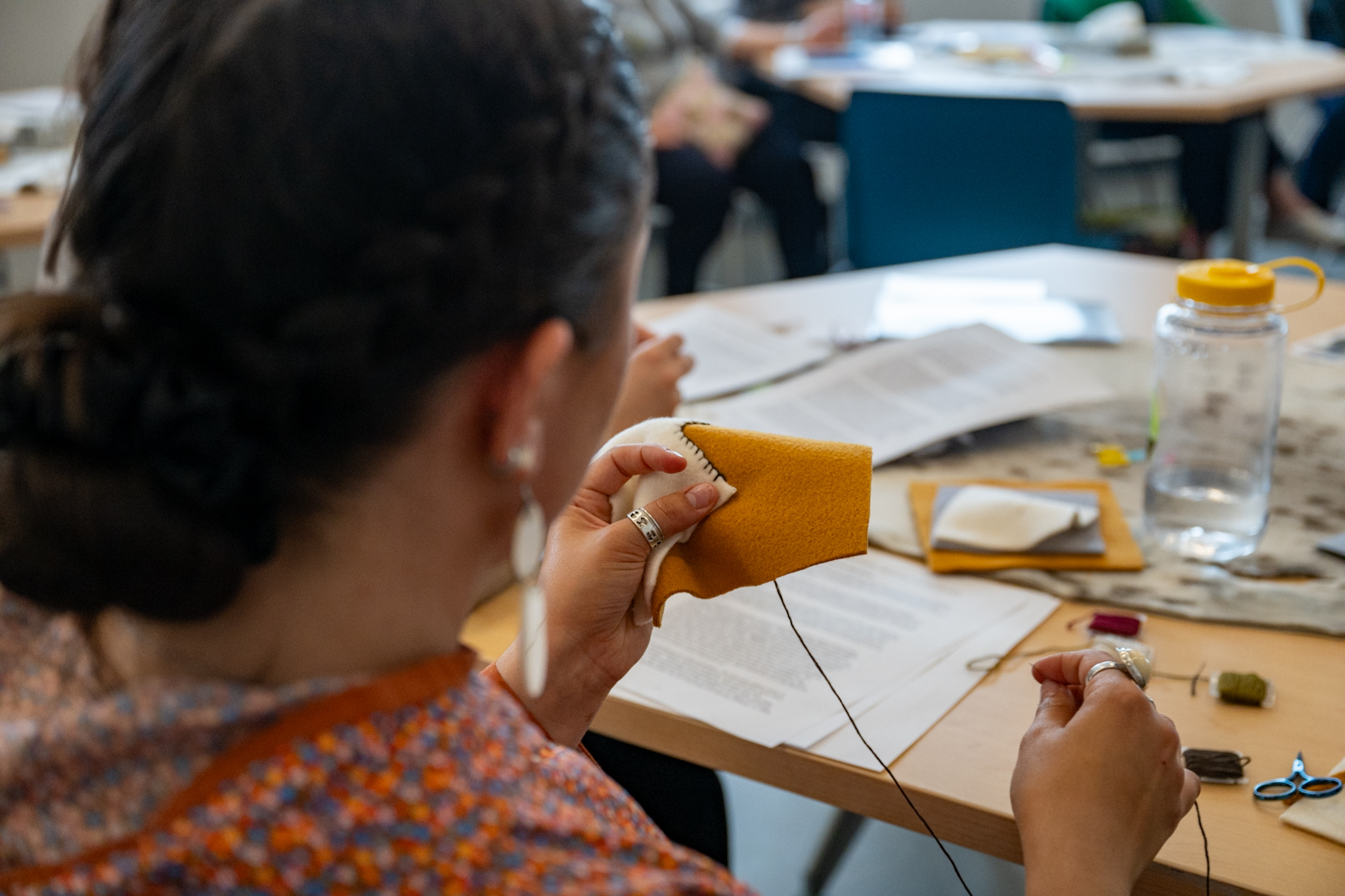 An individual sewing.