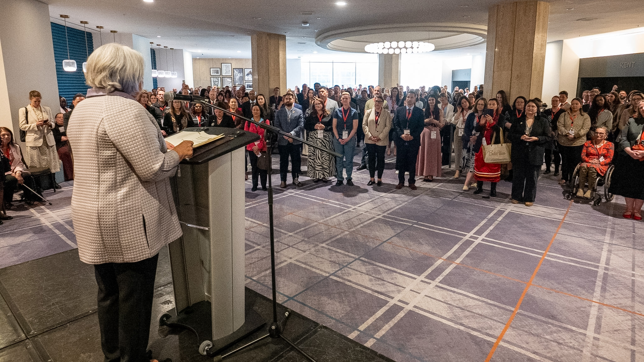 Governor General Mary Simon standing at a podium speaking to a large group of people.