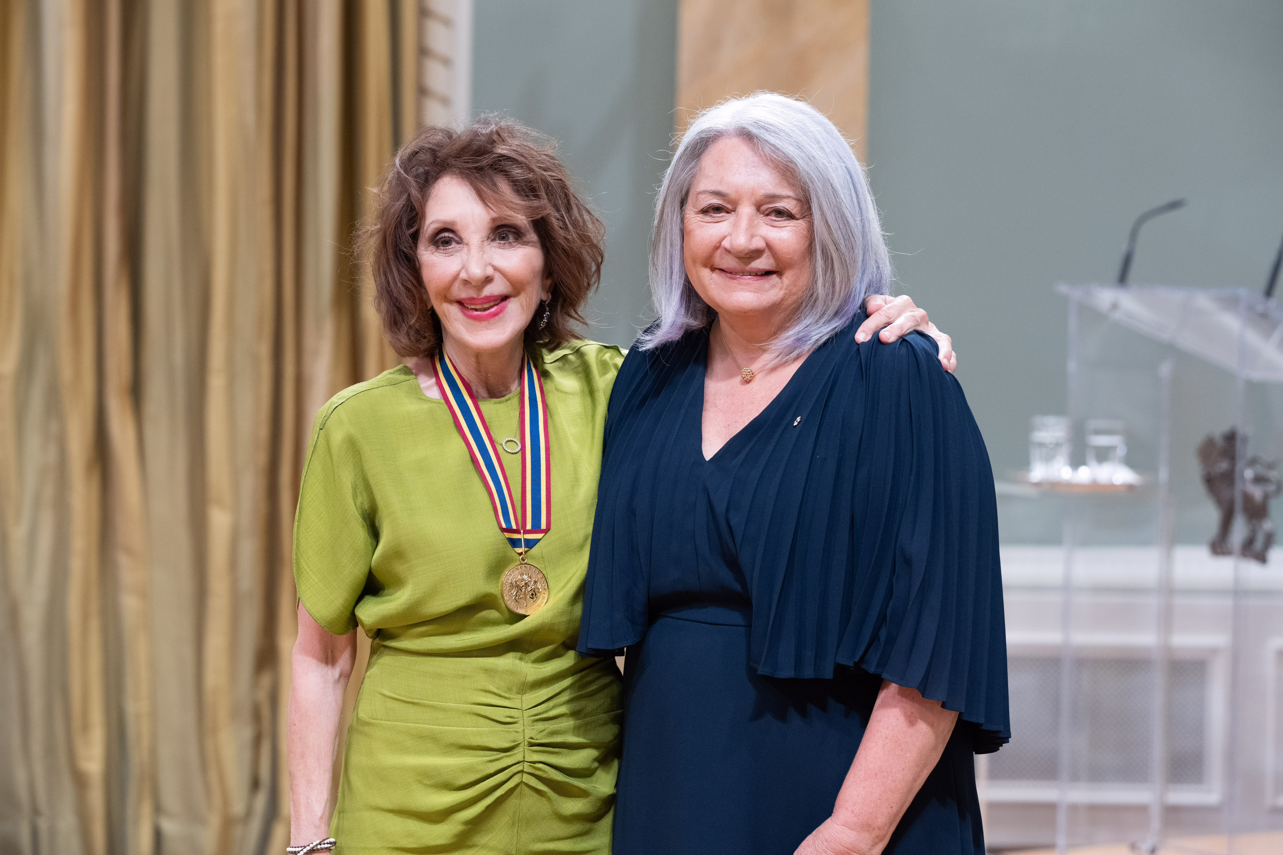 Governor General Mary Simon stands with Andrea Martin after having given her GGPAA in the Ballroom at Rideau Hall