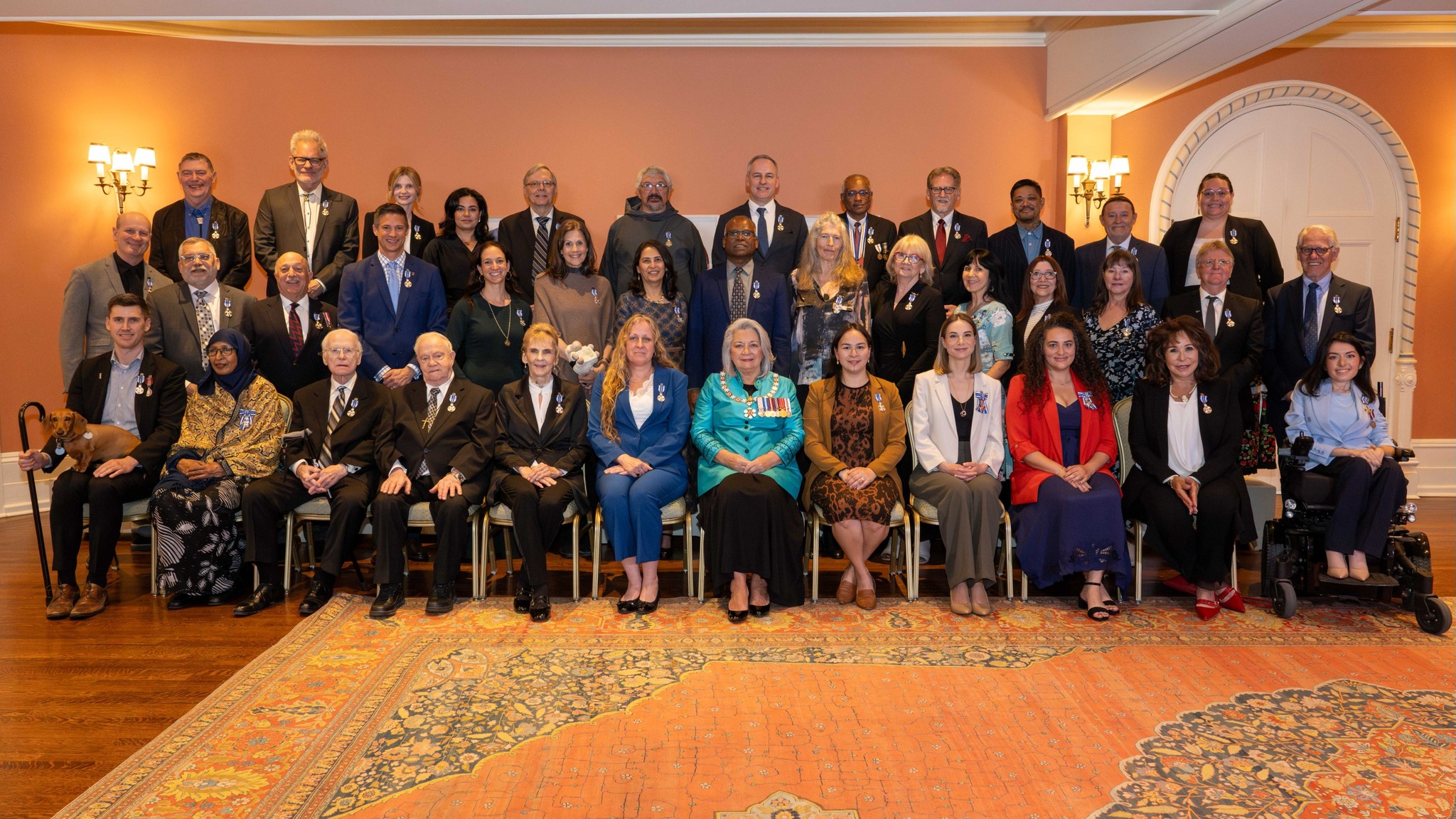 A group photo featuring Governor General Simon and honours recipients. 