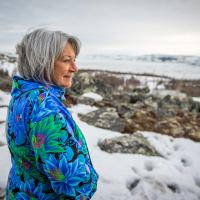 Governor General Mary Simon looking out at nature while in Nunavik.