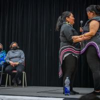 Two throat singers are performing on-stage.