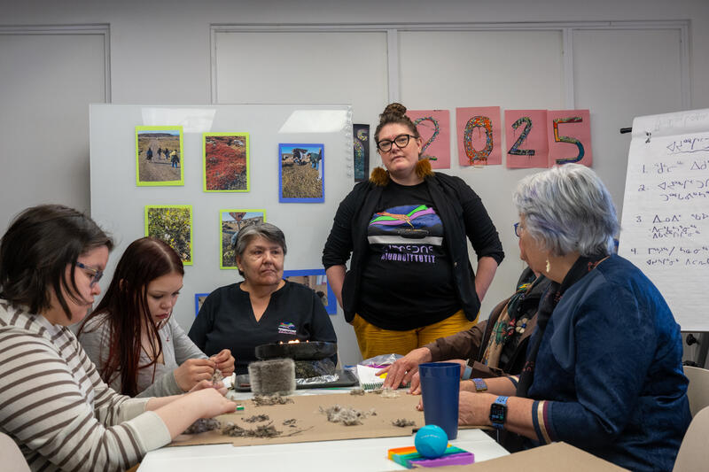 Governor General Mary Simon having a discussion with a group of individuals at the Piruqatigiit Resource Centre.