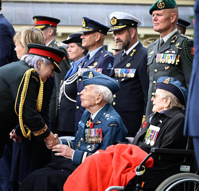 Governor General Mary Simon meeting a veteran at the Freedom Parade. 