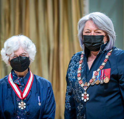 Noni MacDonald is standing next to the Governor General.