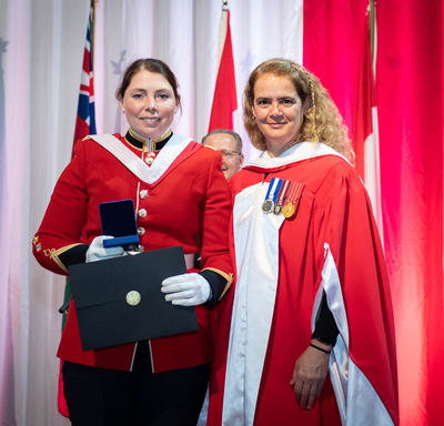  The Governor General gives the Governor General's Academic Medal to a winning student.