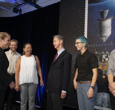 The Governor General meets with people who worked on the Apollo 11 stamp.