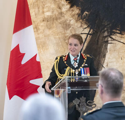 The Governor General delivers remarks at a podium.