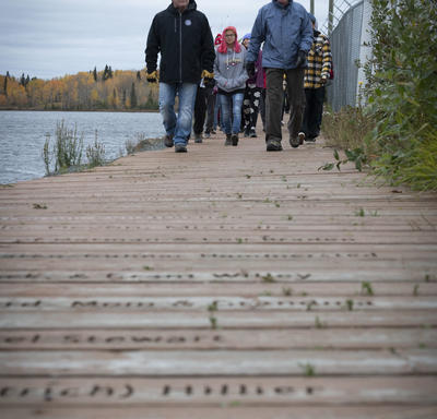 Group of people walking around Ross Lake. 