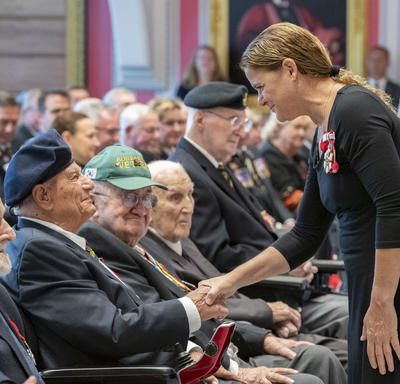 The Governor General shakes hands with a veteran during the launch of the 2019 National Poppy Campaign.