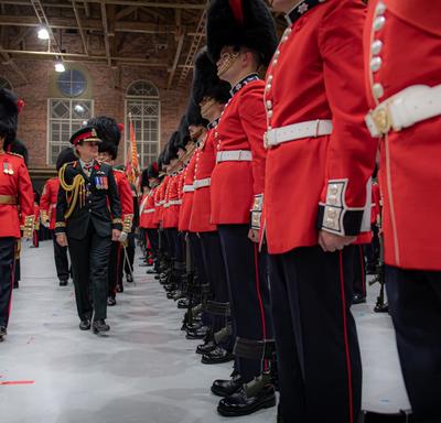 The Governor General inspects the Governor General's Foot Guards during a ceremony.
