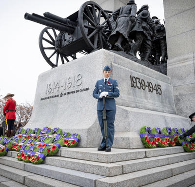 An officer stands solemnly by the monument during the National Remembrance Day Ceremony.