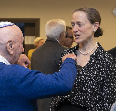  Leslie Scanlon, the Ambassador of Canada to Poland, speaks with a Holocaust survivor.