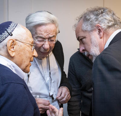 Canadian Member of Parliament, Rhéal Éloi Fortin, chats with Holocaust survivors. 