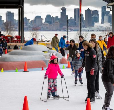 The Governor General skates with members of the community. 