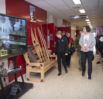 The Governor General walks down a hallway of Dennis Franklin Cromarty High School.