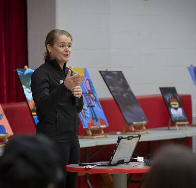 The Governor General delivers a presentation at a high school.