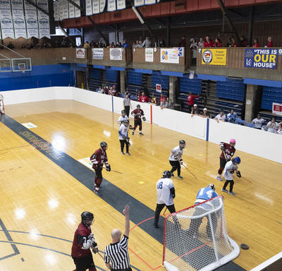 Special Olympics Athletes on court during a fast-paced play of floor hockey.