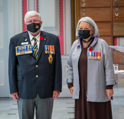 Governor General Mary May Simon and Mr. Bruce Julian are standing beside each other in the Tent Room. 
