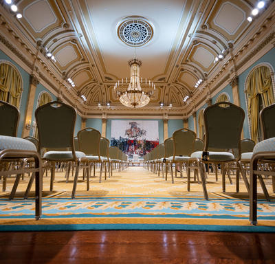 The Ballroom at Rideau Hall. There is no one in the room. The photo is taken at the back of the ballroom facing the front. 