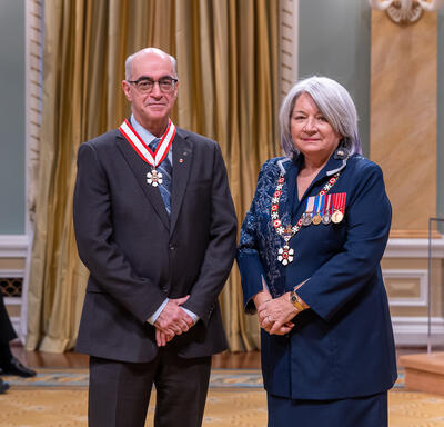 Alain-G. Gagno is standing next to the Governor General.
