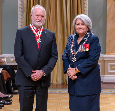 Guy Rouleau is standing next to the Governor General.