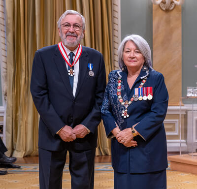 Yanick Villedieu is standing next to the Governor General.