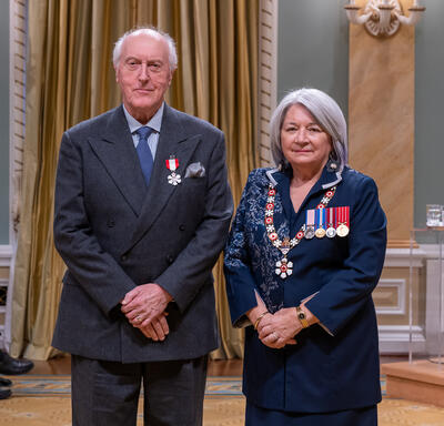 Ronald Duncan Barr is standing next to the Governor General.