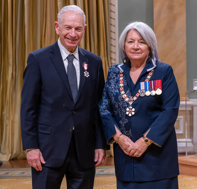  Allan Borodin is standing next to the Governor General.