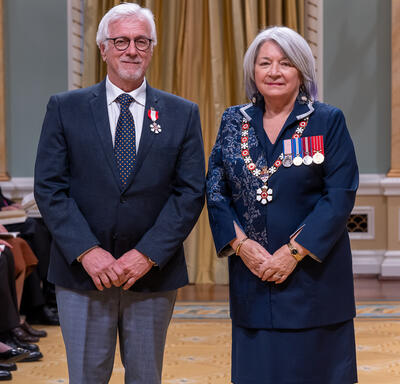 Serge Demers is standing next to the Governor General.