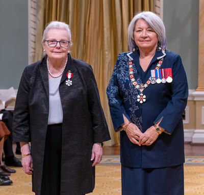 The Honourable Joan Fraser is standing next to the Governor General.