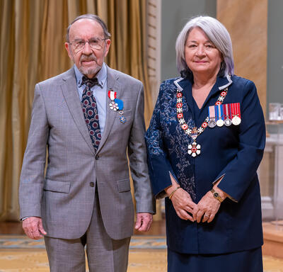 Gilbert Lacasse is standing next to the Governor General.