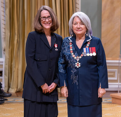 Sarah Fellowes Milroy is standing next to the Governor General.