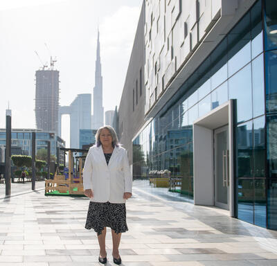 Governor General  Mary Simon posing for a picture on a sidewalk in Dubai.