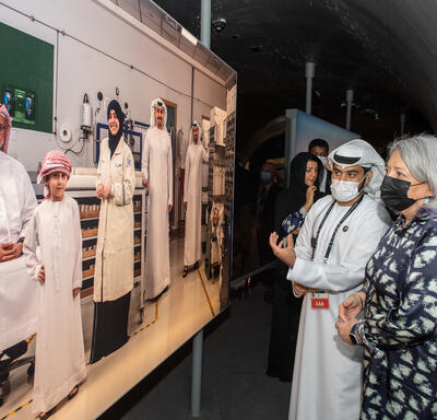 Governor General Mary Simon is examining an exhibit at Expo 2020 Dubai.