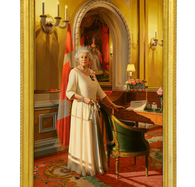 A portrait of The Queen. She wears a white dress and a silver crown, and stands in front of a Canadian flag. A portrait of Queen Victoria is in the background. 