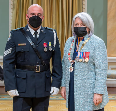 Sergeant Michael Fonseca standing next to the governor general.