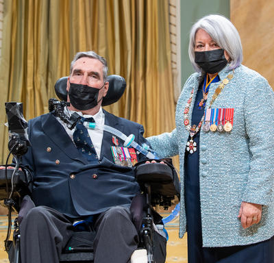 Colonel Gregory Hug next to the governor general.