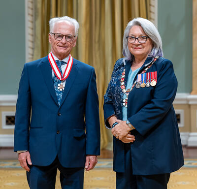 Arthur J. Ray is standing next to the Governor General.