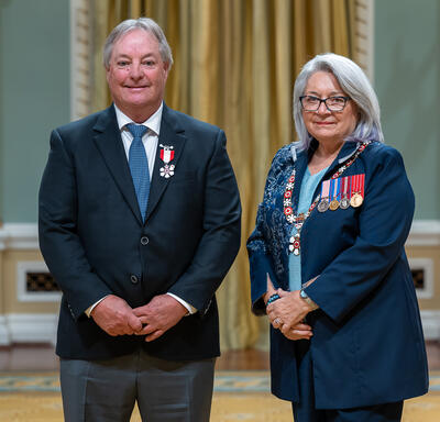 W. J. Brad Bennett is standing next to the Governor General.
