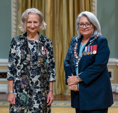 Sara Louise Diamond is standing next to the Governor General.