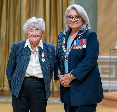 Rose Lipszyc is standing next to the Governor General.