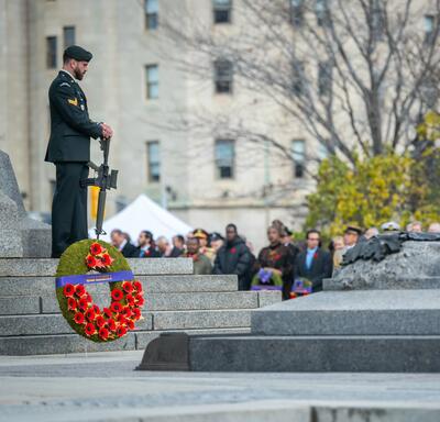 A wreath in honour of Queen ElizabethII is near the Tomb of the Unknown Soldier in Ottawa. A sentinel is standing guard.
