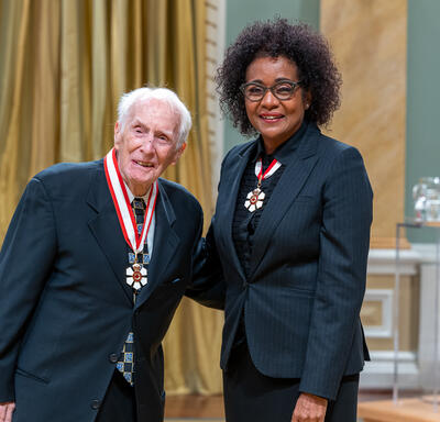 Frank Joseph Hayden is standing next to The Right Honourable Michaëlle Jean.