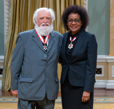 Ian Stewart Hodkinson is standing next to The Right Honourable Michaëlle Jean.