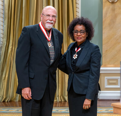 The Reverend Dr. James V. Scott is standing next to The Right Honourable Michaëlle Jean.